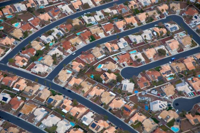 an aerial view of a city with lots of houses
