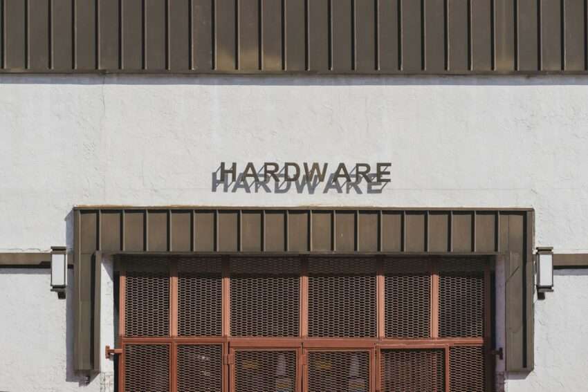 a white building with a sign that says hardware hardware