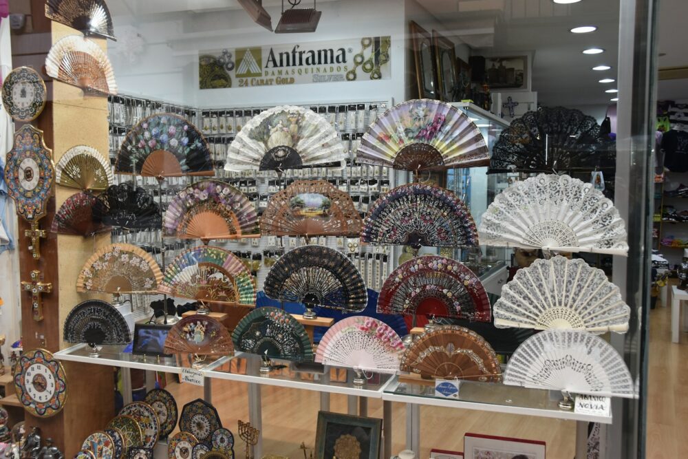 a display case filled with lots of different types of fans