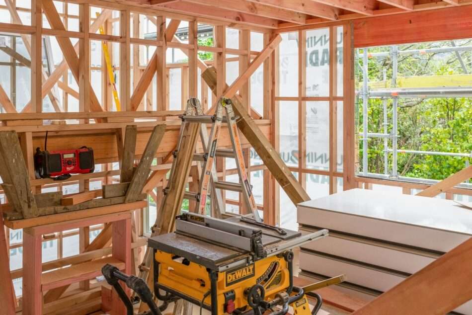 Construction site showing wood framework and tools.